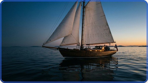 Imagem gerada a partir do prompt: barco a vela na hora azul